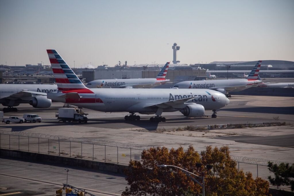 American Airlines jet narrowly avoids collision with Delta plane at JFK after mistakenly crossing runway; investigation reveals pilot distraction and confusion.